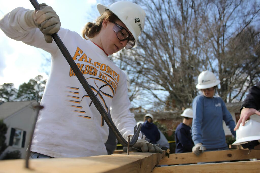 High school student participating in extracurricular activities as part of college admissions strategy