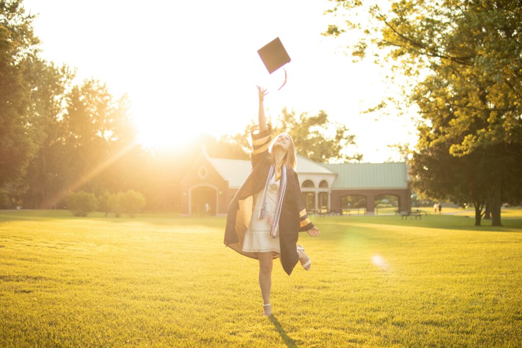 Student celebrating college acceptance after working with admissions support