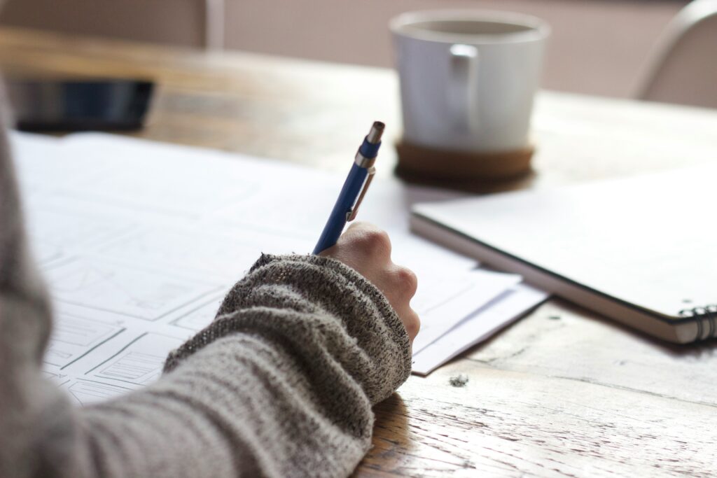 Senior writing college application essays during the admissions process