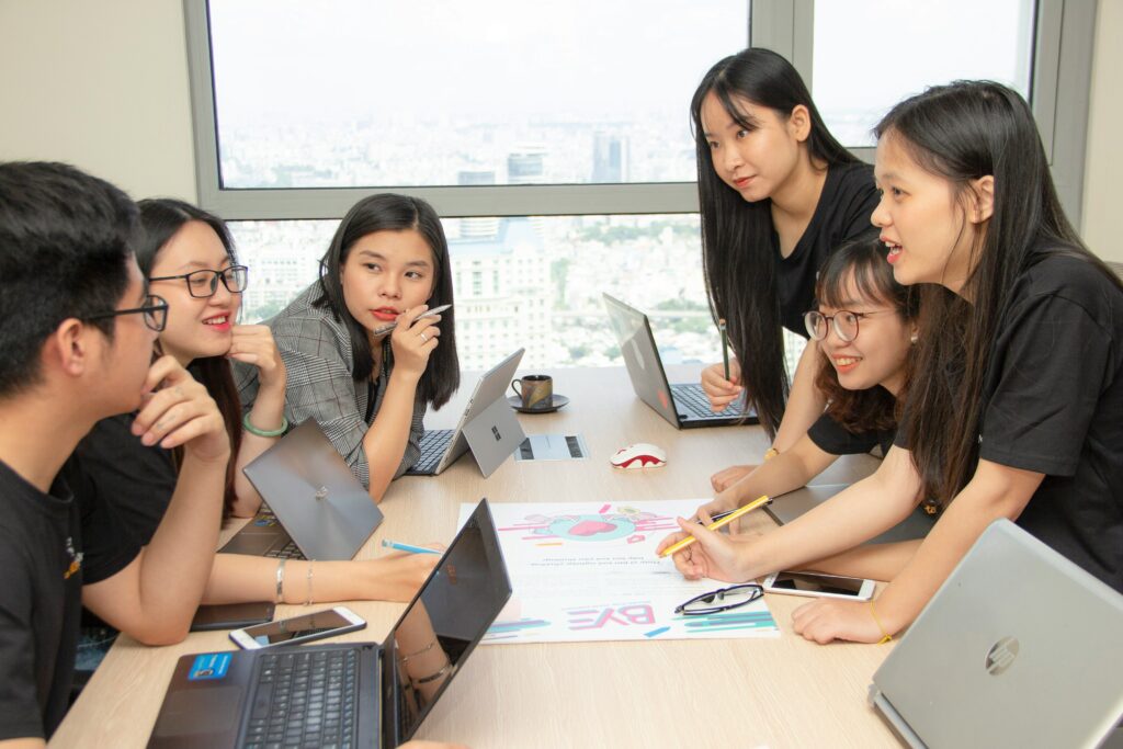 High school students working together on a group project showing teamwork and delegation